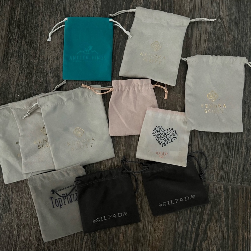 Kendra Scott Jewelry Pouches in Black, Cream, Pink, and Teal